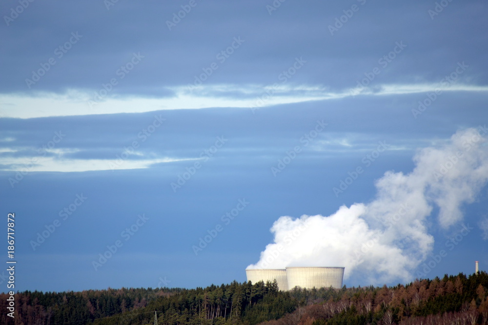 A nuclear power station in a forest A nuclear power station in a forest