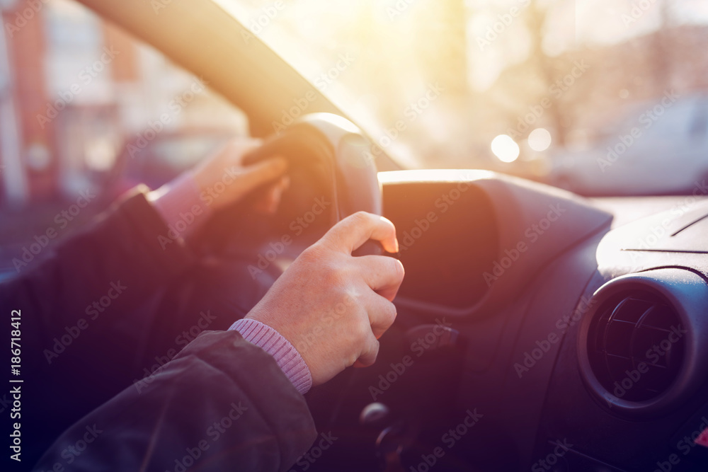 Female driver holding steering wheel Female driver holding steering wheel