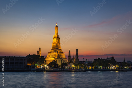 Wat Arun Temple at sunset  twilight with floating lanterns in bangkok Thailand.