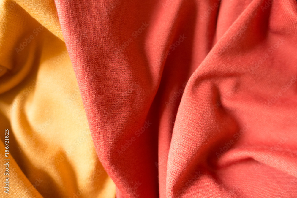 Crumpled yellow and orange simple jersey fabric Crumpled yellow and orange simple jersey fabric