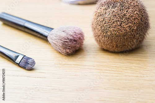 Set of decorative cosmetics on a wooden background, close-up