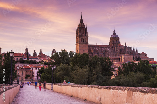 Spain, Castile and Leon, Salamanca, Catedral Nueva de Salamanca and Roman Bridge in long exposure photo