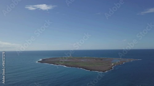 island with lighthouse aerial view from 4k drone
 photo