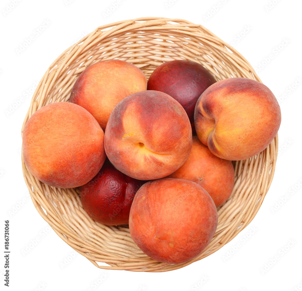 Ripe peach fruit isolated in basket on white background Ripe peach fruit isolated in basket on white background
