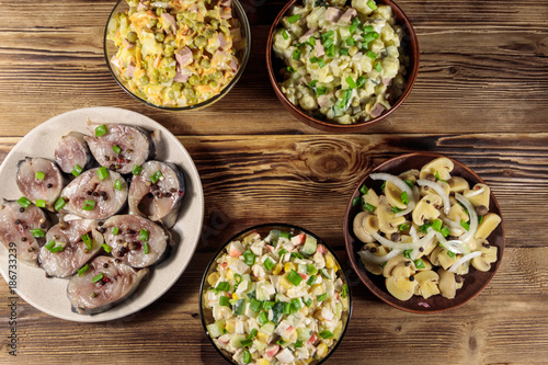 Various festive dishes on wooden table