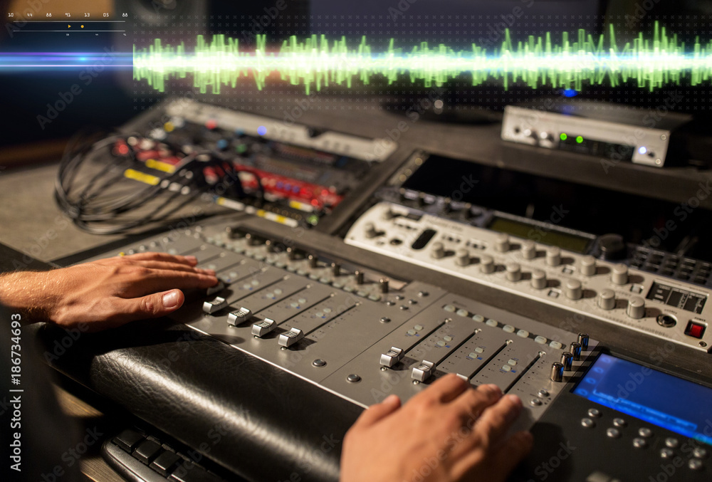 hands on mixing console at sound recording studio hands on mixing console at sound recording studio