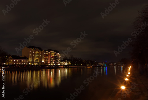 Light festival and the at the river Motala Strom and buildings reflecting in the water during the evening in central Norrkoping in Sweden