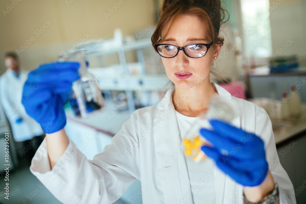 Attractive student of chemistry working in laboratory Attractive student of chemistry working in laboratory
