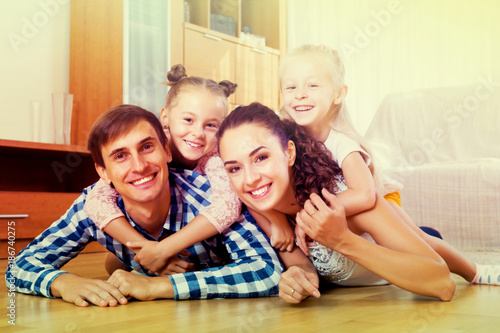 Relaxed family of four posing