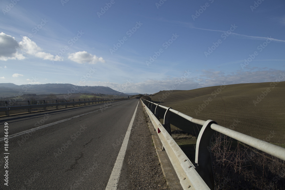 Fototapeta premium Empty road under the blue sky