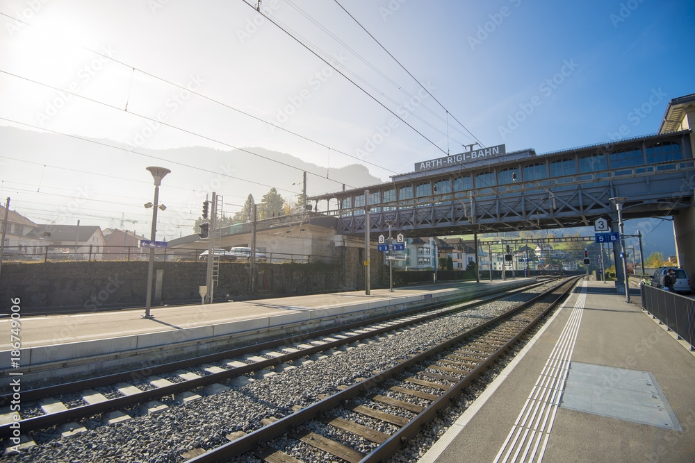 Naklejka premium Mt. Rigi, Switzerland - November 1, 2017: a Rigi Railways train leaving the Rigi-Kulm station . Rigi Railways (German: Rigi-Bahnen) is a group of railways on Mount Rigi.Switzerland