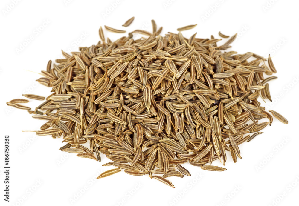 Pile of cumin seeds isolated on white background Pile of cumin seeds isolated on white background