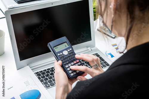 Accountant working with calculator