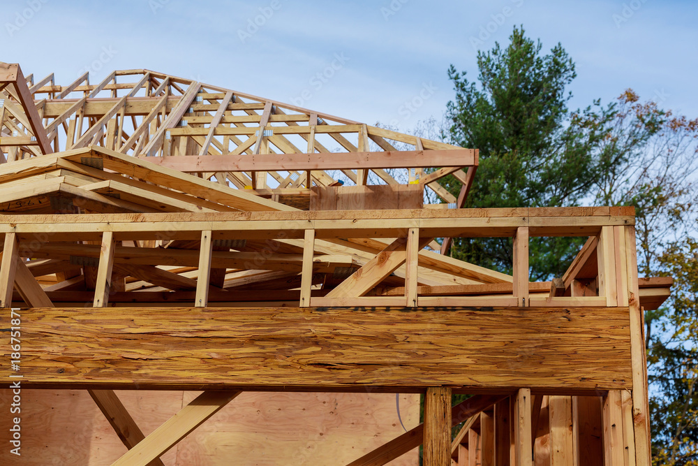 New build roof with wooden home construction framing Timber frame house, real estate. New build roof with wooden home construction framing Timber frame house, real estate.