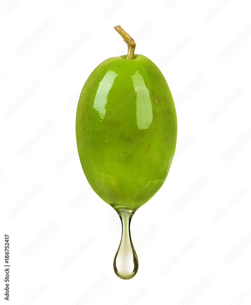 Obraz premium Green olive with a drop of oil close up on white background