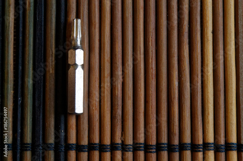 Head for screwdriver (bits) on wooden background, Tools collection turn-screw