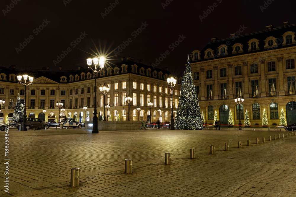 Paris, France - December 17, 2017: Christmas trees and illumination at Place Vendome in Paris by night