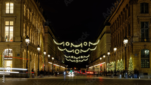 Fototapeta Naklejka Na Ścianę i Meble -  Paris, France - December 17, 2017: Christmas trees and illumination at Place Vendome in Paris by night