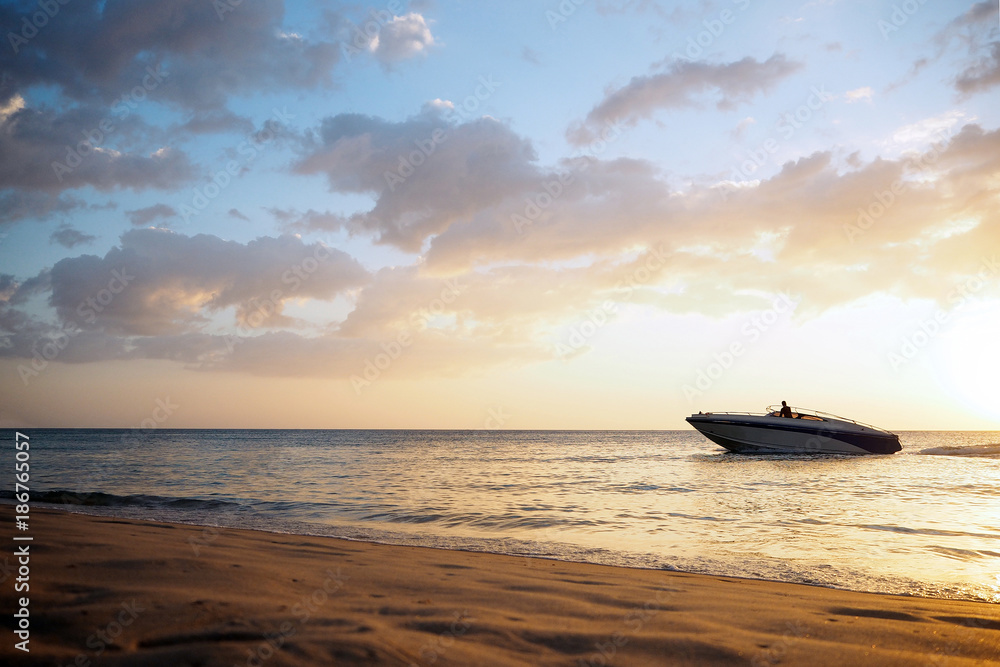 summer. the boat sails by the sea at sunset summer. the boat sails by the sea at sunset