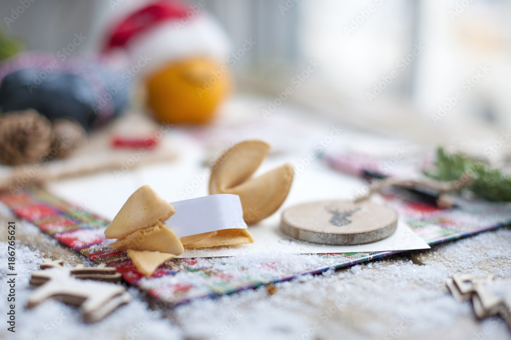 traditional cookies with wishes for Christmas and New Year, on the table with decor near the window traditional cookies with wishes for Christmas and New Year, on the table with decor near the window