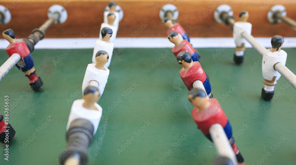 Fototapeta premium Wooden players in a foosball table