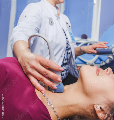 Young Woman Doing Neck Ultrasound Examination