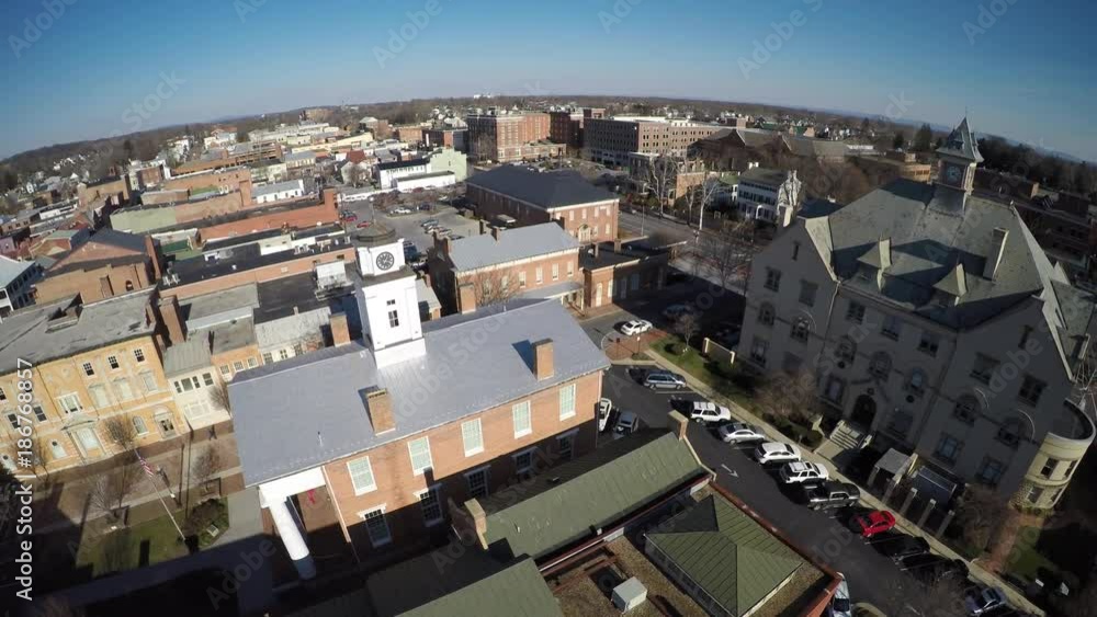Rising aerial over and to the right of the old courthouse museum and the new courthouse in Winchester, VA. Rising aerial over and to the right of the old courthouse museum and the new courthouse in Winchester, VA.