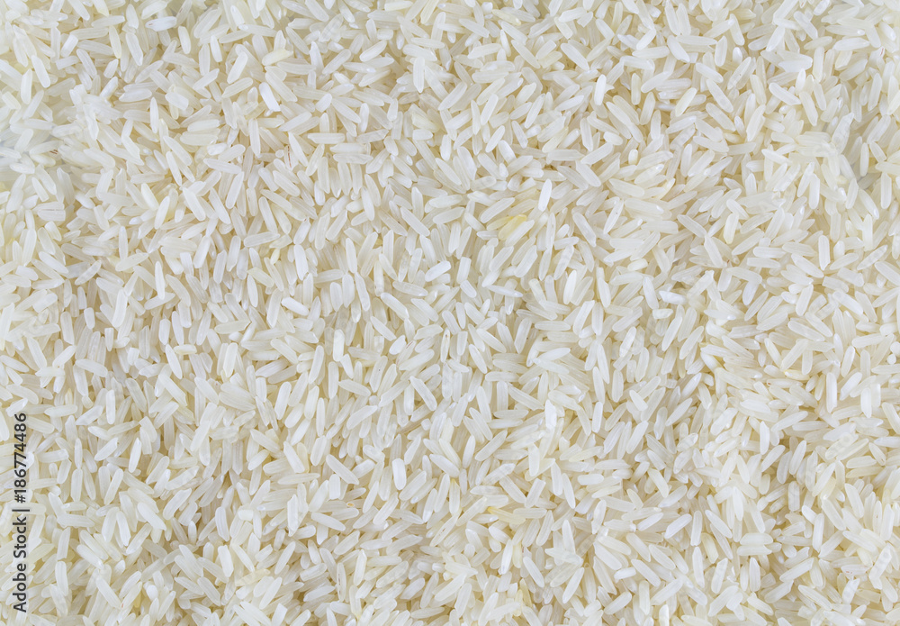 White long rice background, uncooked raw cereals, macro closeup