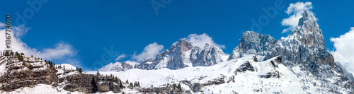 Beautiful wide panorama of winter Alps in Italy seen from Passo Rolle ski resort