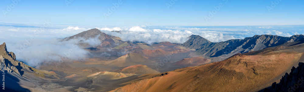 Haleakala Crater - A panoramic view of the crater at summit (10,023 feet) of Haleakala, also called East Maui Volcano, surrounded by sea of clouds. Maui, Hawaii, USA.