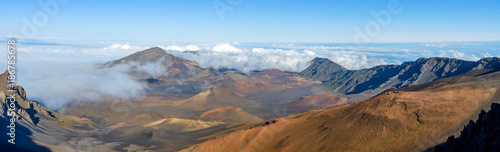 Haleakala Crater - A panoramic view of the crater at summit (10,023 feet) of Haleakala, also called East Maui Volcano, surrounded by sea of clouds. Maui, Hawaii, USA.