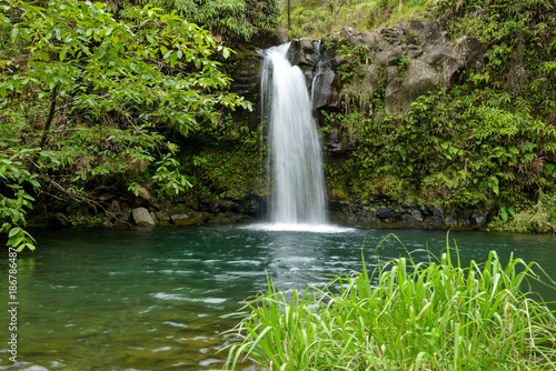 Tropical Waterfall - Lower Puaa Kaa Waterfall and a small crystal clear pond, inside of a dense tropical rain-forest, off the Road to Hana Highway, Maui, Hawaii, USA.