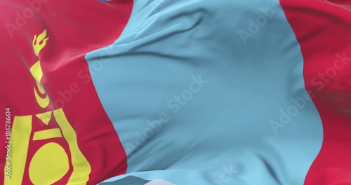 Mongolia flag waving at wind with blue sky in slow, loop photo