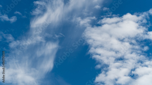 Whispy clouds in a blue sky