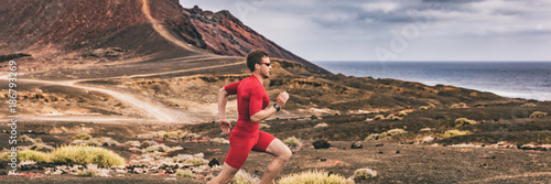 Runner trail running athlete man training cardio in landscape banner background. Sport outdoor in nature. Ultra run race.