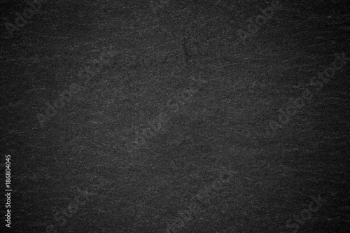 Dark grey black slate background or natural stone texture. © modify260