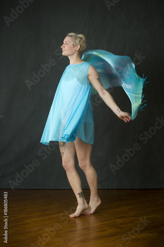 Wallpaper Mural Active young woman dancer throwing blue scarf in the studio. Torontodigital.ca