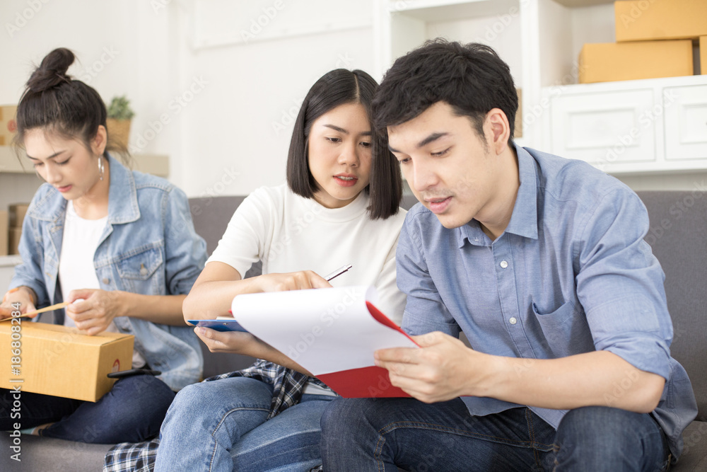 Group of Asian people working together for SME project. Young Owner people startup for Business Online, SME, Delivery Project. Online Business Concept. Group of Asian people working together for SME project. Young Owner people startup for Business Online, SME, Delivery Project. Online Business Concept.