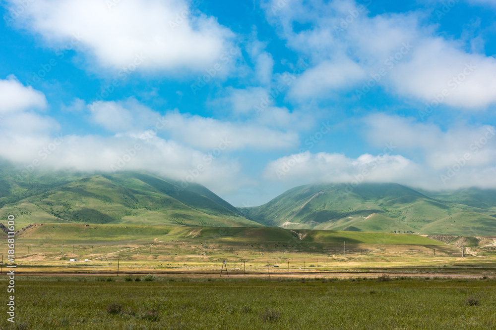 Obraz premium Fog over green mountains