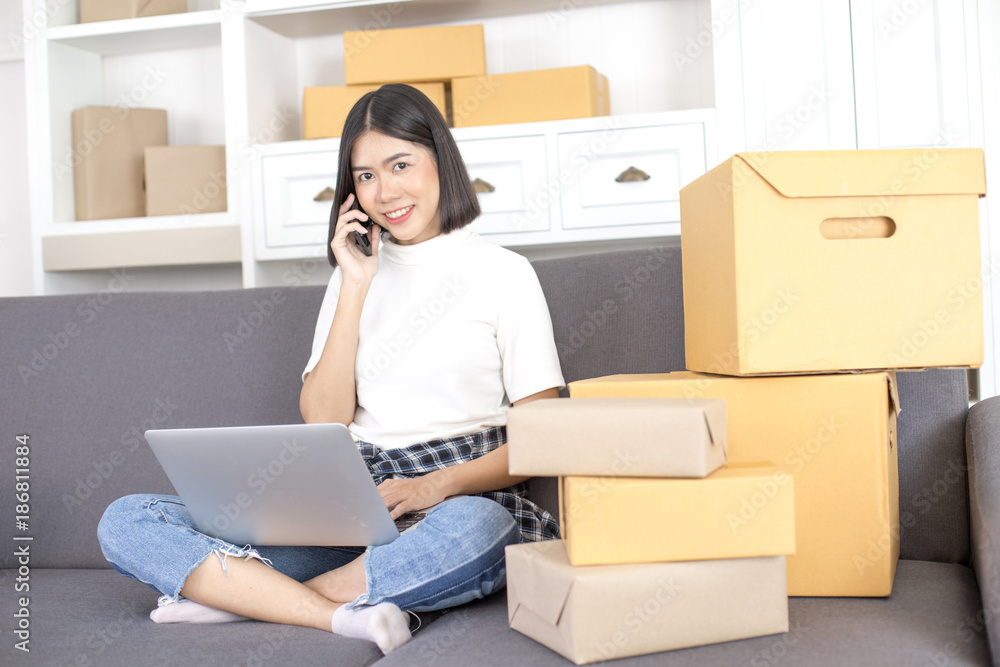 Asian woman working at home. People with SME, Delivery, Online Business success concept. Asian woman working at home. People with SME, Delivery, Online Business success concept.