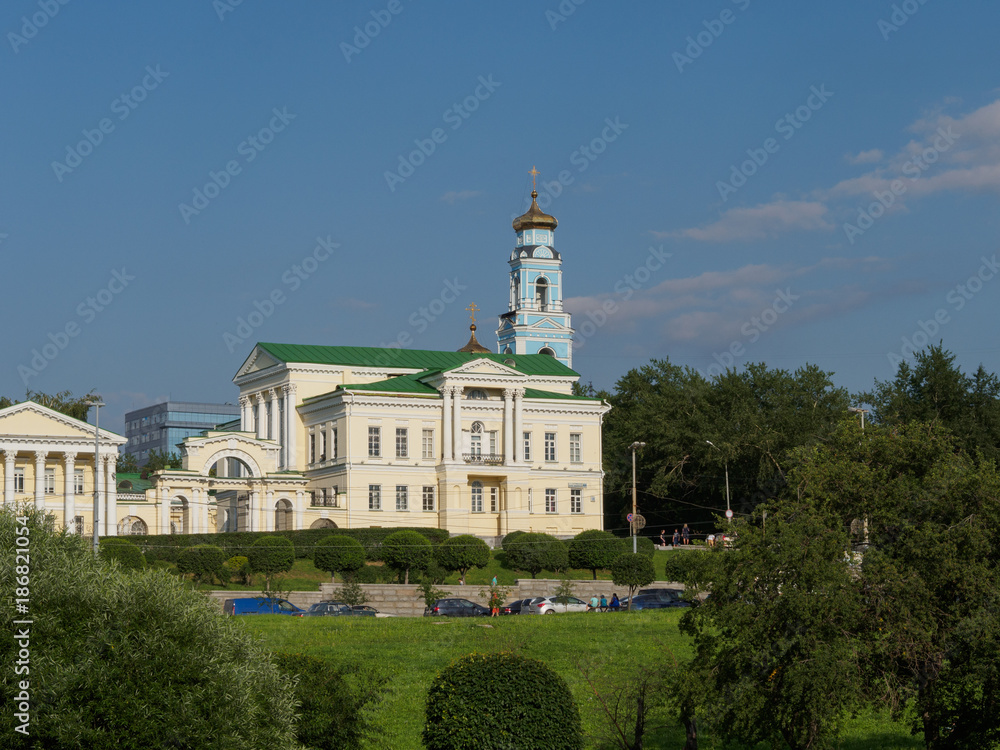 Yekaterinburg, Russia - 07/20/2017: Rastorguev-Kharitonov manor and Church of the Ascension of Christ behind it