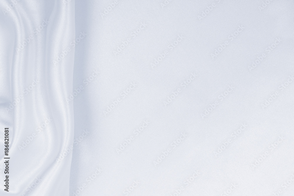 Smooth elegant grey silk or satin luxury cloth as wedding background. Luxurious Christmas background or New Year background design Smooth elegant grey silk or satin luxury cloth as wedding background. Luxurious Christmas background or New Year background design