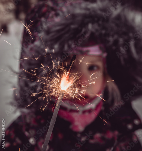 little girl in the snow and bengal fire