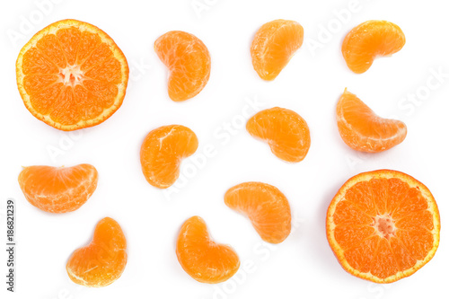 slices of mandarin or tangerine with leaves isolated on white background. Flat lay, top view. Fruit composition