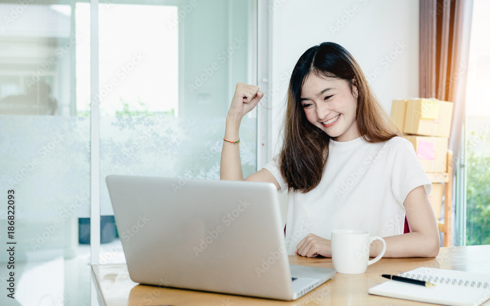 Young asian girl is freelancer with her private business at home office, working with laptop, coffee, online marketing, Customer order and packaging or packing. Young asian girl is freelancer with her private business at home office, working with laptop, coffee, online marketing, Customer order and packaging or packing.