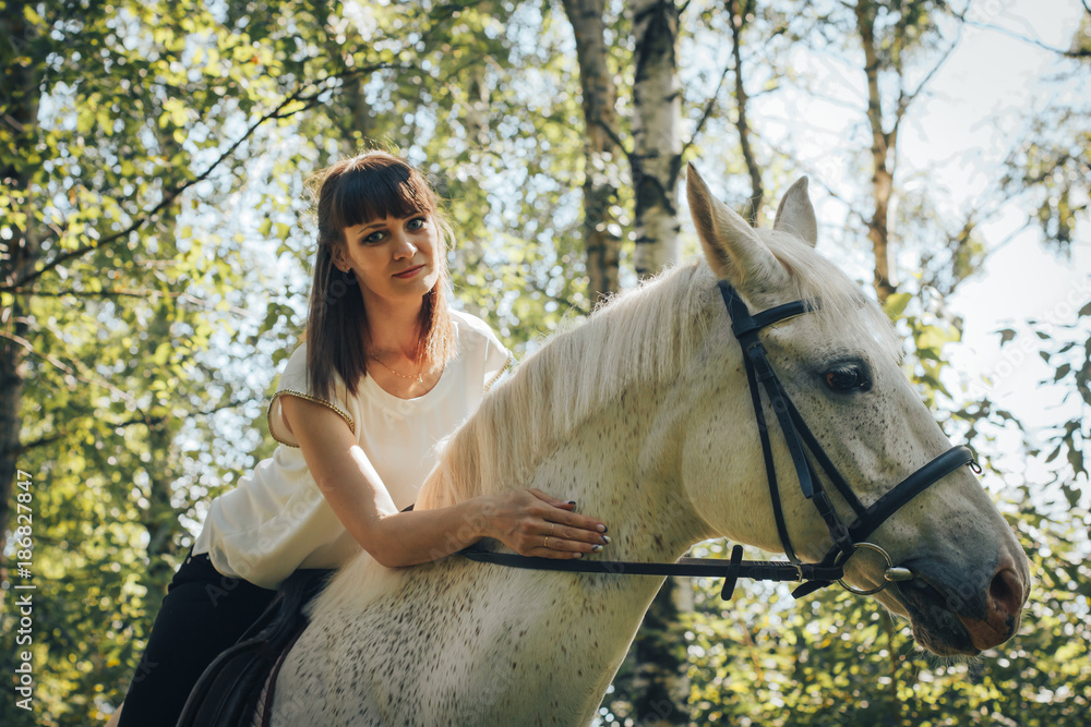 Fototapeta premium Girl and horse in the woods