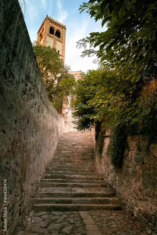 A narrow street of italy with steps of stone. Monselice, Italy.