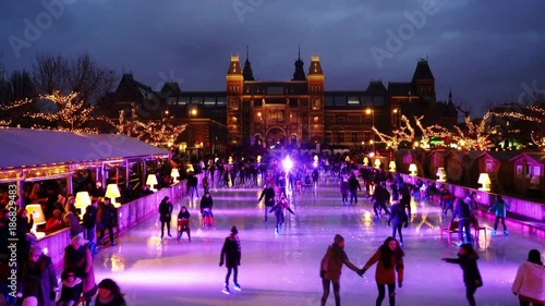 Christmas Ice Skating at the famous Museumplein in Amsterdam with the Rijksmuseum