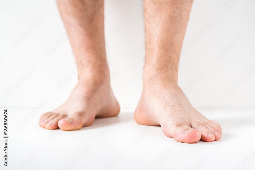 Barefoot. Cares about a man's clean and soft foot skin. Body care concept. Barefoot. Cares about a man's clean and soft foot skin. Body care concept.