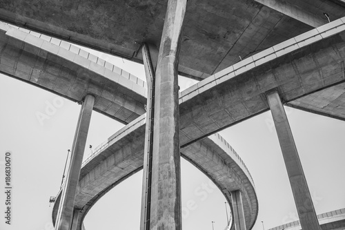 Black and White image Bridge of Industrial Rings or Bhumibol Bridge is concrete highway road junction and interchange overpass and cross the Chao Phraya River, Thailand.